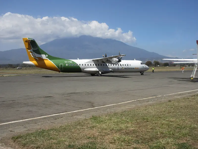 Plane at Arusha airport with Mount Meru behind