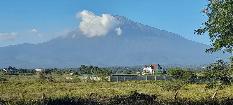 Mount Meru seen from Arusha in the afternoon light