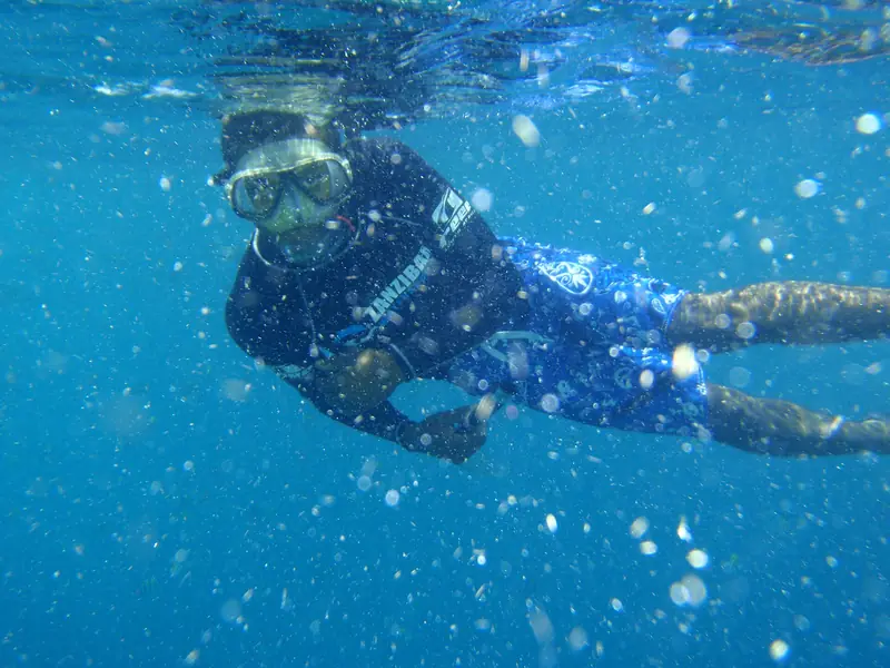 Snorkelling in the clear water off Zanzibar